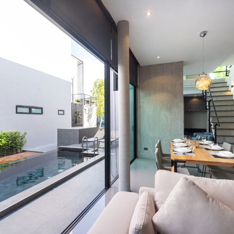 Dining table in loft design and open space to pool access - DG Pinnacle Home Loans - Jumbo Loan Program - Miami Mortgage Company