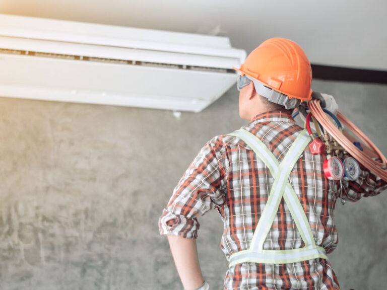 Technician repairing HVAC system - DG Pinnacle Home Loans