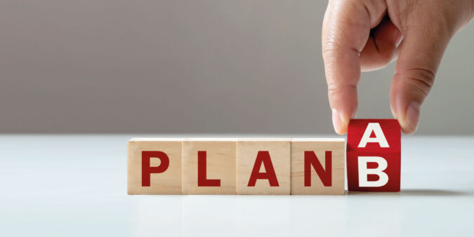 Hand flips wooden cube blocks from plan a to plan b What to do when your home purchase is denied - DG Pinnacle Home Loans - Miami Mortgage Company