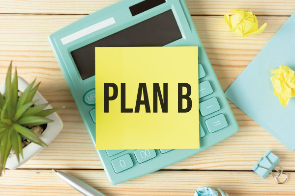 Plan b word written on yellow paper on calculator - What to do when your home purchase is denied - DG Pinnacle Home Loans - Miami Mortgage Company