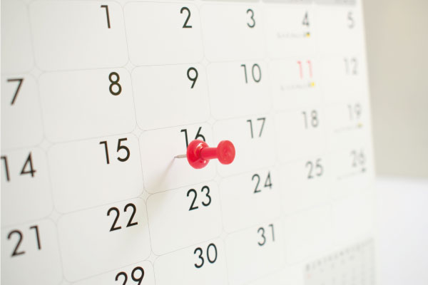 Red pin on the event calendar background implying a deadline - What to do when your home purchase is denied - DG Pinnacle Home Loans - Miami Mortgage Company