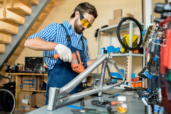 Self-employed contractor working with drill - DG Pinnacle Home Loans - Miami Mortgage Lender