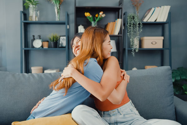 Two happy young girls hugging and celebrating - 4 Tips to Use a Down Payment Gift Correctly - DG Pinnacle Home Loans - Miami Mortgage Lender