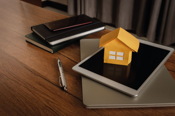 Business concept close up model house and some accessories - MythBusters for the First-Time Homebuyer - DG Pinnacle Home Loans - Miami Mortgage Lender