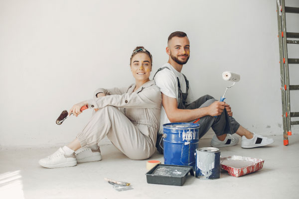 Young couple making some repairs to their home | Renovation Mortgages - FHA 203K loans | DG Pinnacle Home Loans - Miami Mortgage Lender