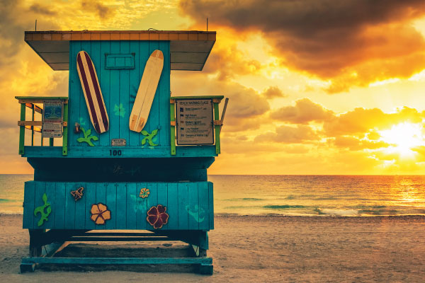 Miami South Beach sunrise with lifeguard tower - 10 Ways to Benefit From The Current Shift in Real Estate - DG Pinnacle Home Loans - Miami Mortgage Lender