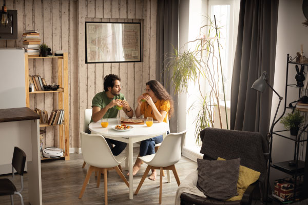 Couple enjoying lunch at home - Top 7 Tax Benefits of Owning a Home - DG Pinnacle Home Loans - Miami Mortgage Lender