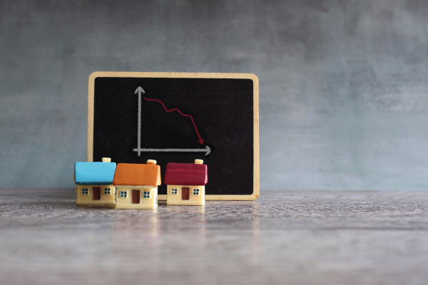 Toy house and graph home price concept - What's ahead for home sales and prices - DG Pinnacle Home Loans - Miami Mortgage Lender