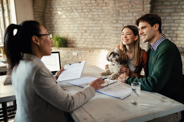 Young couple at mortgage lender office with puppy | What can I use to qualify | DG Pinnacle Home Loans - Miami Mortgage Lender