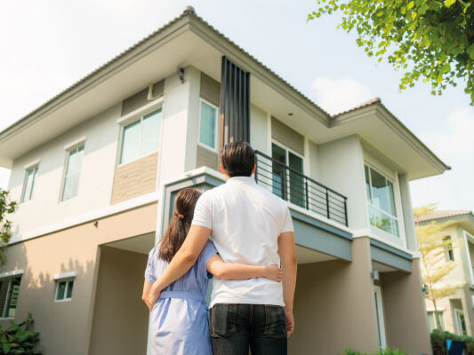 Young happy couple contemplating their new house - How Long Does It Take To Close On A House? - DG Pinnacle Home Loans - Miami Mortgage Funding Lending Company