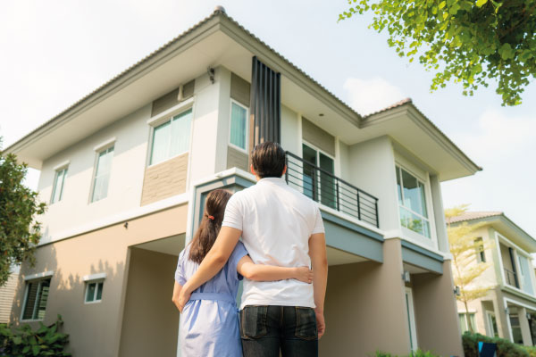 Young happy couple contemplating their new house - How Long Does It Take To Close On A House? - DG Pinnacle Home Loans - Miami Mortgage Funding Lending Company