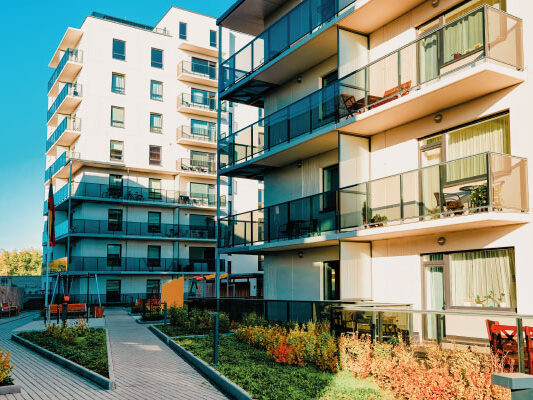 Beautiful Condo apartaments building with sunrise | Advantages of Condos for First-Time Homebuyers | DG Pinnacle Home Loans - Miami Mortgage Funding Lender