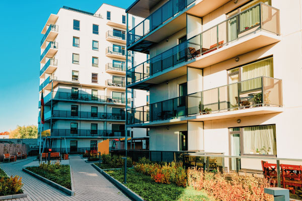 Beautiful Condo apartaments building with sunrise | Advantages of Condos for First-Time Homebuyers | DG Pinnacle Home Loans - Miami Mortgage Funding Lender